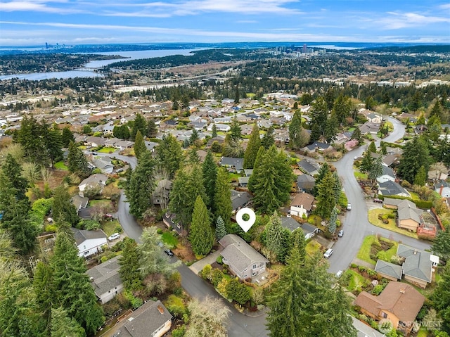 drone / aerial view featuring a residential view and a water view