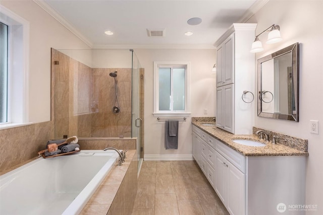 full bathroom featuring visible vents, a sink, a shower stall, crown molding, and a bath