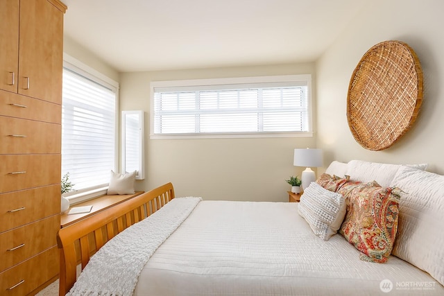 bedroom with multiple windows