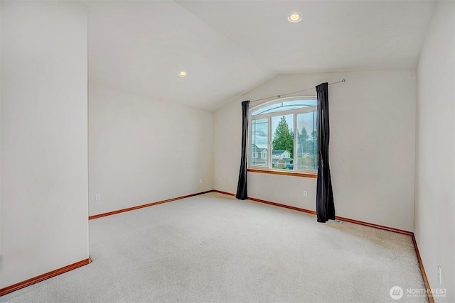 interior space featuring carpet flooring, recessed lighting, baseboards, and lofted ceiling