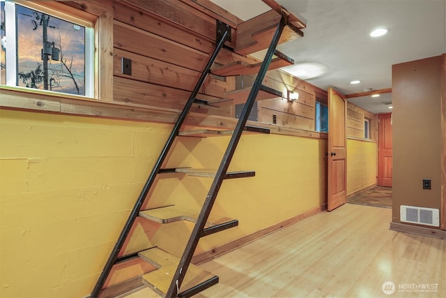 stairs with visible vents, recessed lighting, baseboards, and wood finished floors