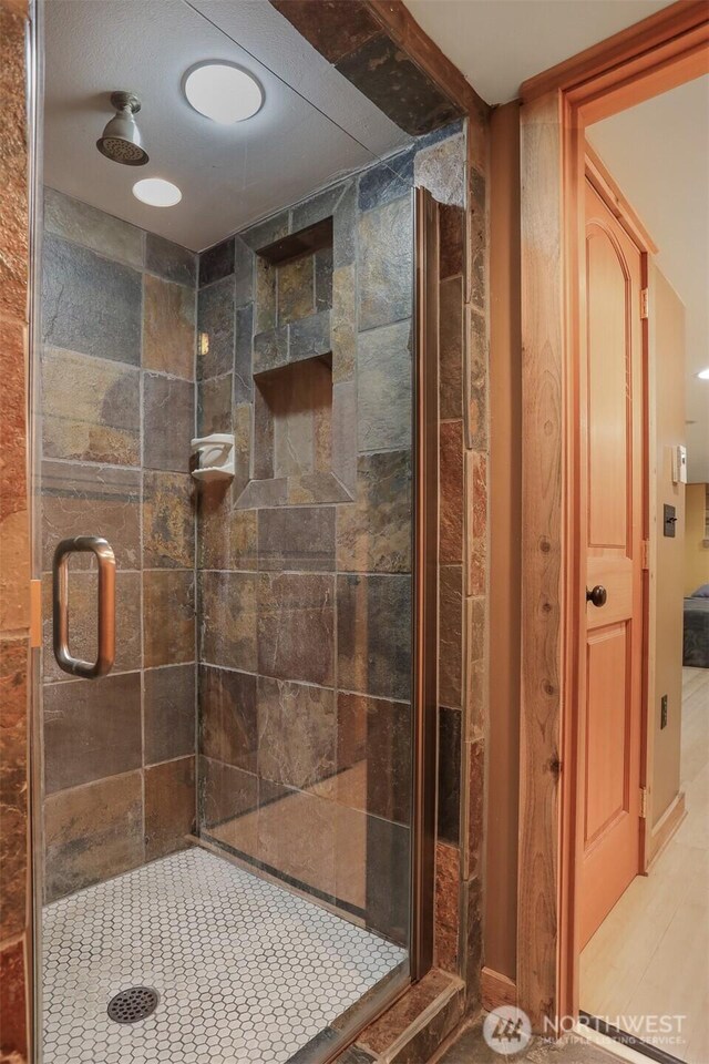 full bathroom with a shower stall