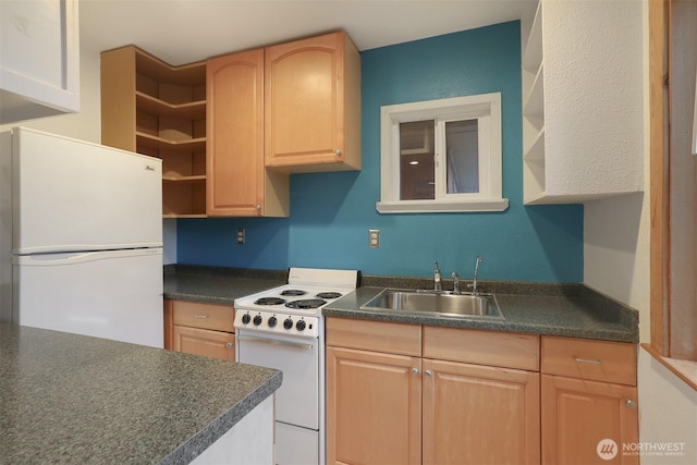 kitchen with white appliances, light brown cabinets, open shelves, a sink, and dark countertops