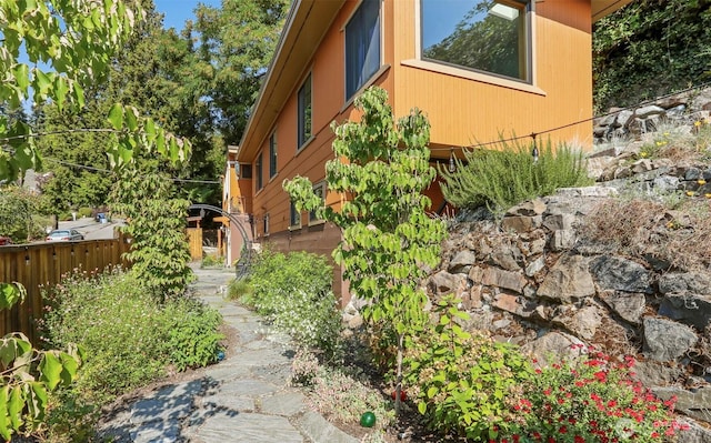 view of property exterior with fence