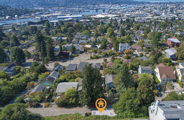 birds eye view of property featuring a residential view and a water view