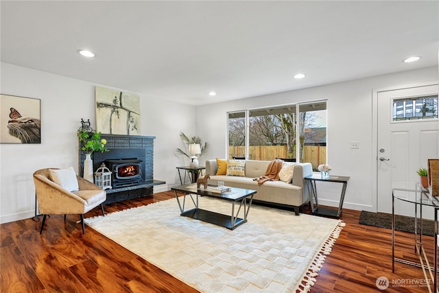 living area with recessed lighting, baseboards, and wood finished floors