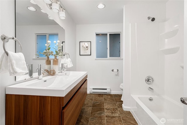 bathroom featuring baseboards, a baseboard radiator, double vanity, toilet, and shower / bathtub combination