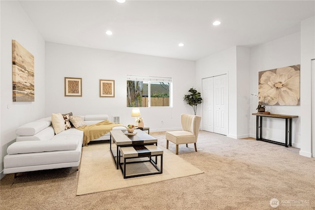 living area with visible vents, recessed lighting, baseboards, and carpet floors