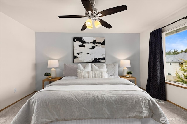 bedroom with carpet flooring, a ceiling fan, and baseboards