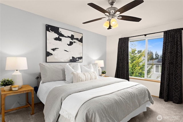 carpeted bedroom featuring ceiling fan