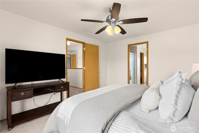 bedroom with light carpet and a ceiling fan