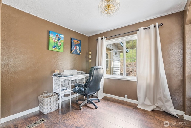 home office featuring visible vents, baseboards, and wood finished floors