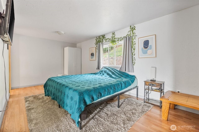 bedroom with light wood-type flooring