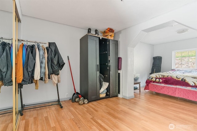 bedroom with wood finished floors