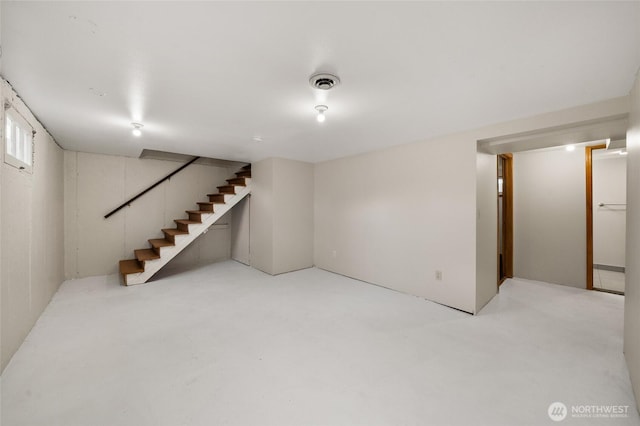 basement with visible vents and stairs