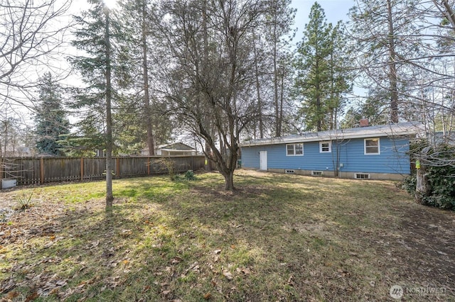 view of yard with a fenced backyard