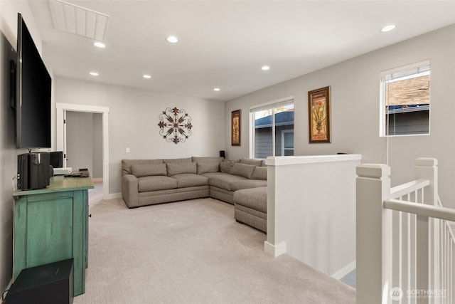 living room featuring light carpet, recessed lighting, visible vents, and a healthy amount of sunlight