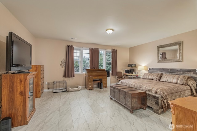 bedroom featuring visible vents and marble finish floor