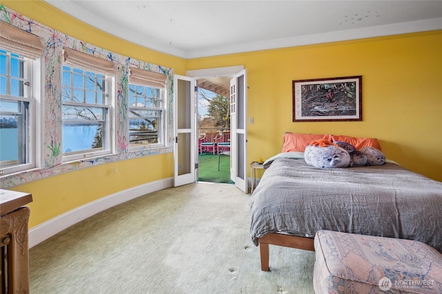 carpeted bedroom with baseboards