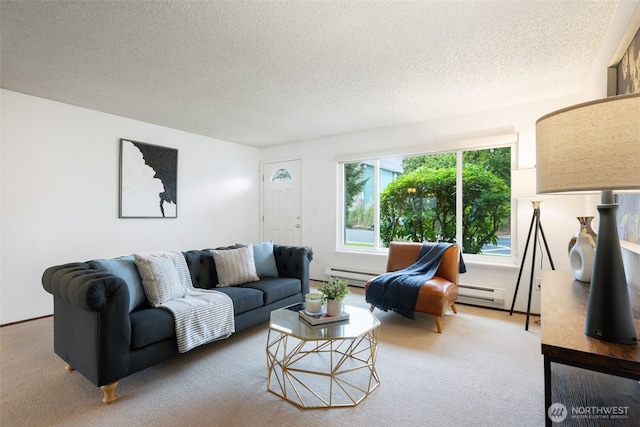 living room featuring a baseboard heating unit, carpet flooring, and a textured ceiling