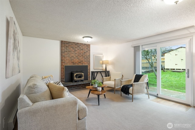 carpeted living area featuring a textured ceiling