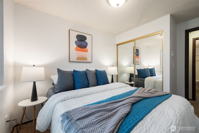 bedroom featuring a closet and a textured ceiling