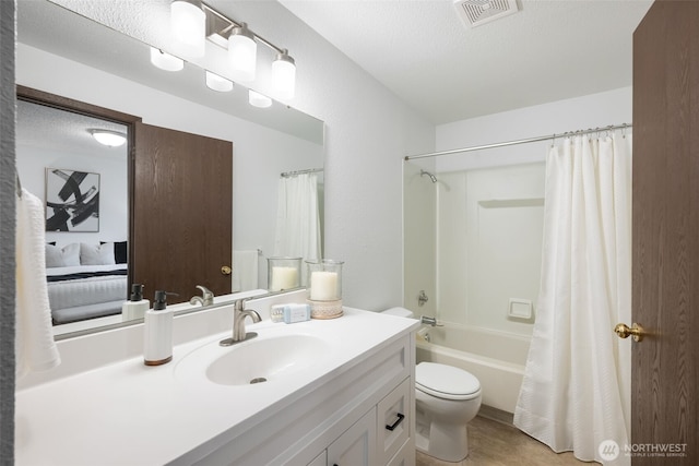 bathroom with visible vents, toilet, vanity, shower / bath combination with curtain, and a textured ceiling