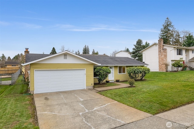 view of front of property featuring a front lawn, an attached garage, fence, and driveway