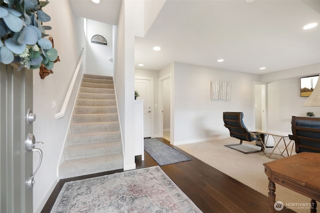 foyer entrance featuring stairway, recessed lighting, wood finished floors, and baseboards