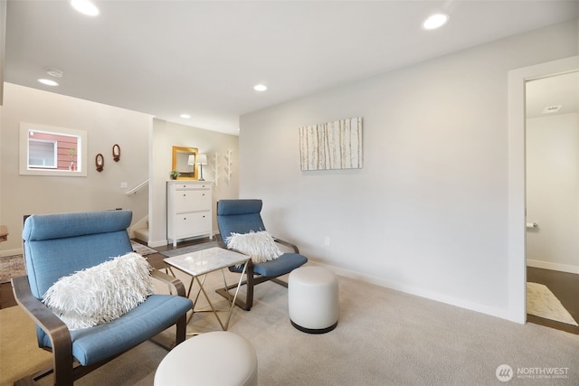 sitting room featuring stairs, recessed lighting, baseboards, and carpet floors