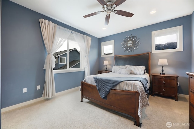 carpeted bedroom with baseboards and ceiling fan