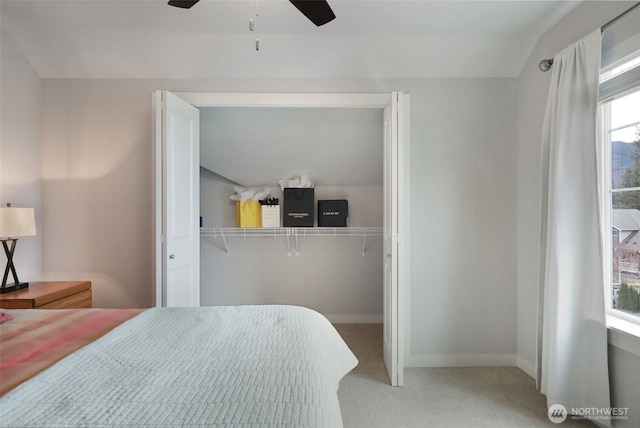 bedroom featuring a ceiling fan, baseboards, and carpet floors