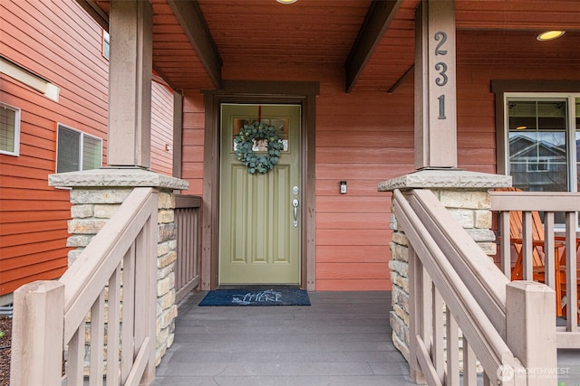 property entrance featuring covered porch