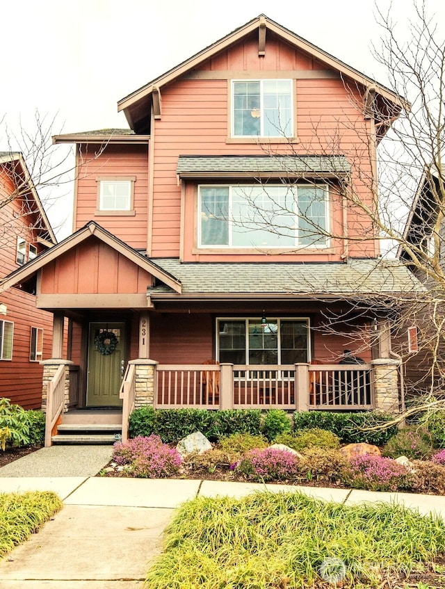 view of front of house featuring a porch, board and batten siding, and a shingled roof