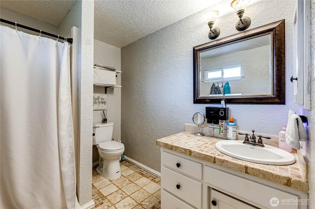 full bath with toilet, a textured ceiling, baseboards, and a textured wall