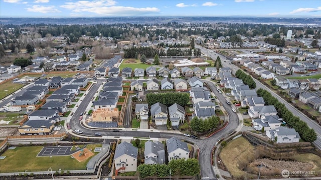 birds eye view of property with a residential view