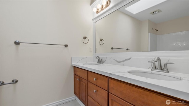 bathroom with double vanity and a sink