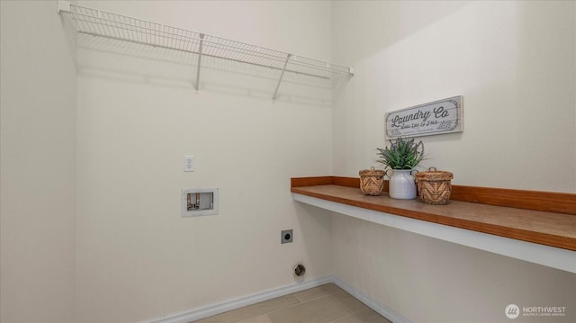 laundry area featuring hookup for a washing machine, light tile patterned floors, baseboards, hookup for an electric dryer, and laundry area