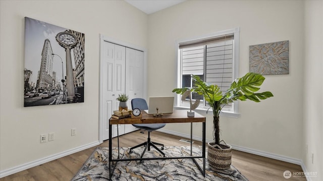 office with visible vents, wood finished floors, and baseboards