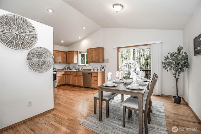 dining room featuring recessed lighting, light wood-style flooring, baseboards, and vaulted ceiling