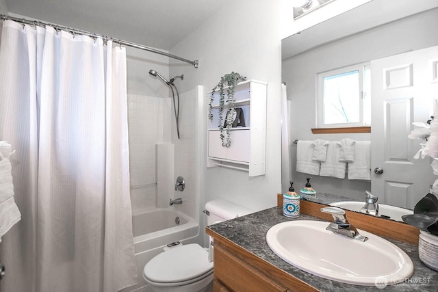 bathroom with shower / tub combo, toilet, and vanity