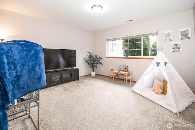 rec room with visible vents, baseboards, and carpet