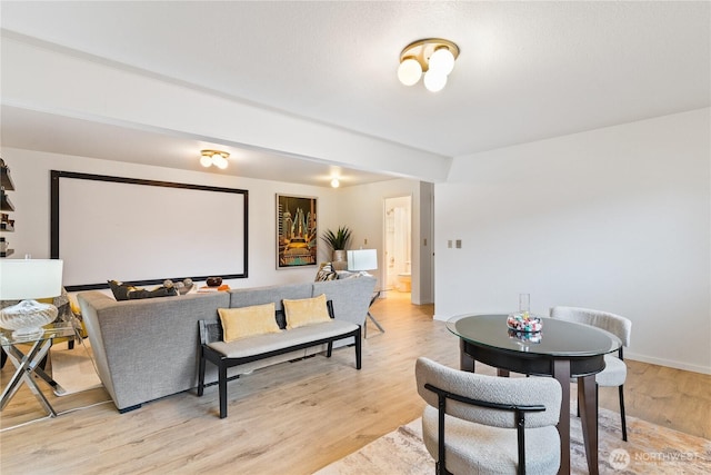 interior space featuring light wood-style flooring and baseboards