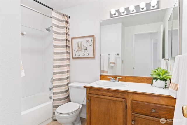 full bathroom featuring toilet, vanity, and shower / bath combo with shower curtain