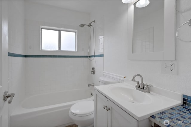 full bathroom featuring toilet, vanity, and  shower combination