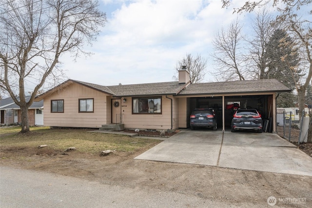 ranch-style home featuring driveway, an attached carport, roof with shingles, and a chimney