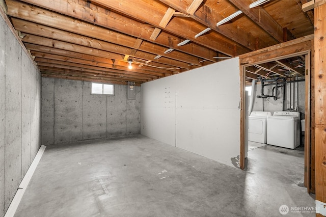 basement featuring washing machine and clothes dryer