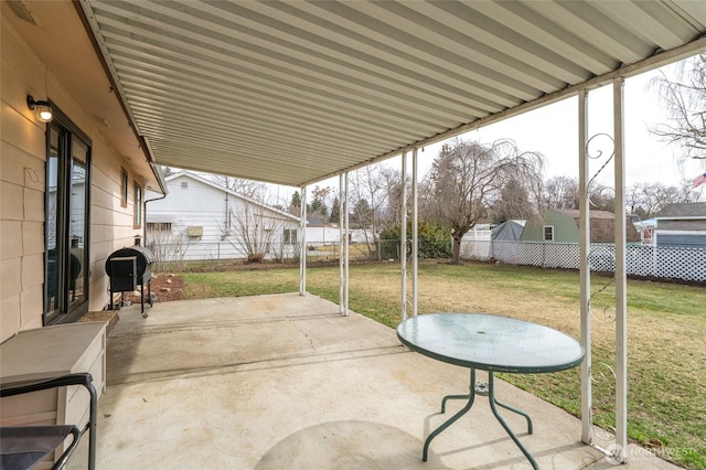 view of patio with area for grilling and a fenced backyard