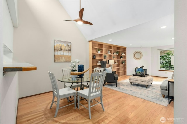 dining room with lofted ceiling, recessed lighting, wood finished floors, and ceiling fan