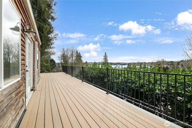 wooden deck with a water view